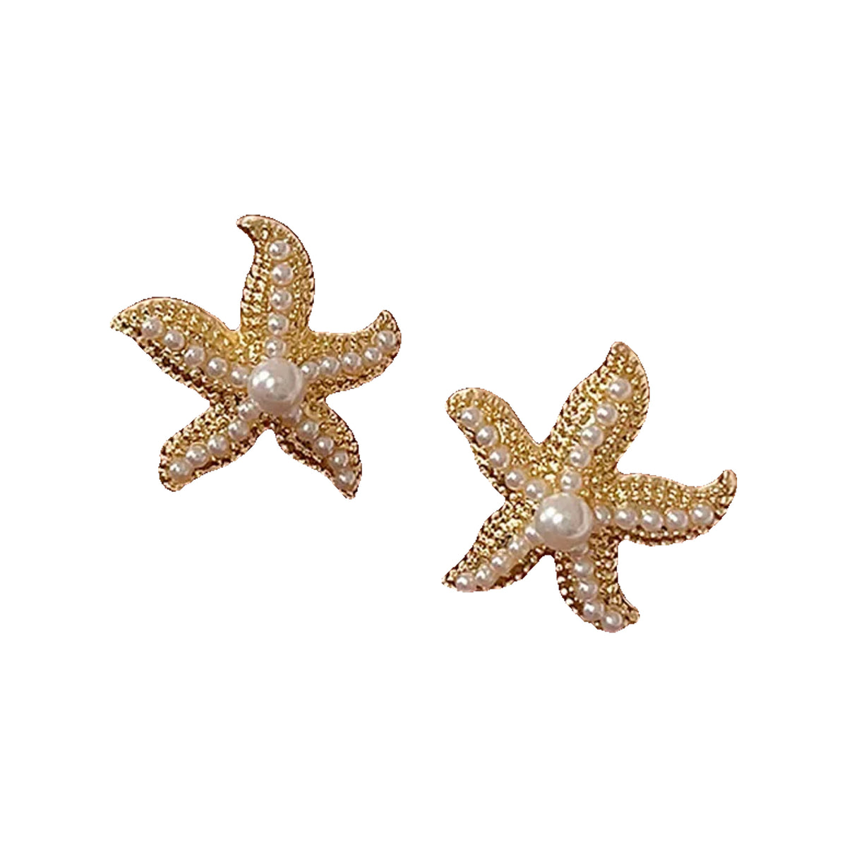 Pair of gold-tone starfish stud earrings shown on a brown surface
