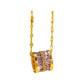 Gold-tone barrel pendant necklace with purple baguette crystals suspended from a faceted chain