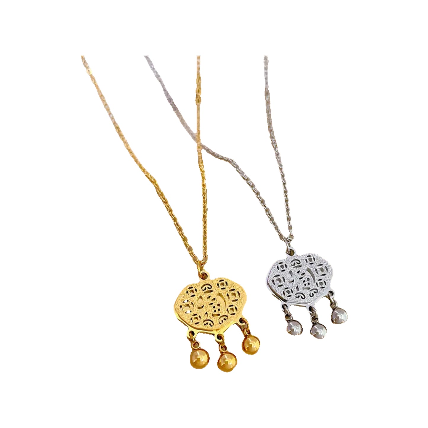 218062ec-4848-4066-8766-af5dbdd020b5 gold-tone and silver-tone filigree pendants with three dangling beads on display