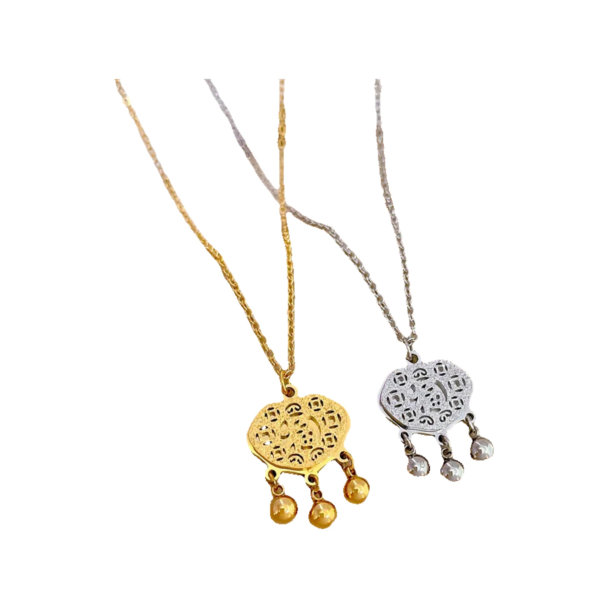 218062ec-4848-4066-8766-af5dbdd020b5 gold-tone and silver-tone filigree pendants with three dangling beads on display