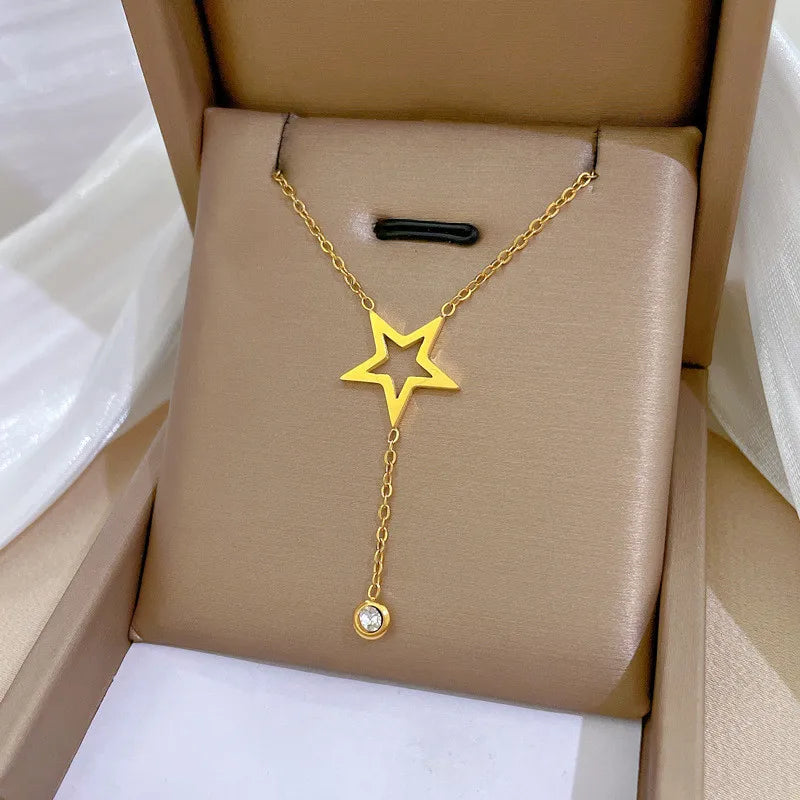 Gold-tone star Y-necklace with a single drop stone in a presentation box