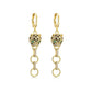 Pair of gold-tone leopard head huggie earrings with dangling linked rings on a white background