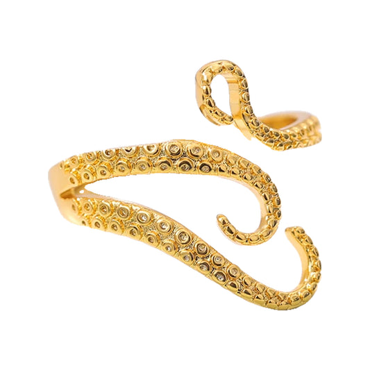 Gold-tone octopus tentacle adjustable wrap ring with textured suckers on a white surface.