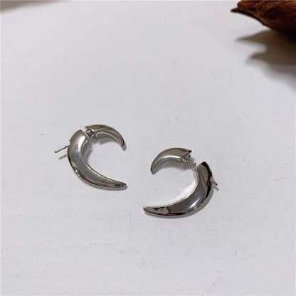 Silver-tone crescent claw hoops shown side by side on a white background