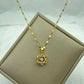 gold-tone broken heart pendant with pavé clear stones and a jagged center split on a chain