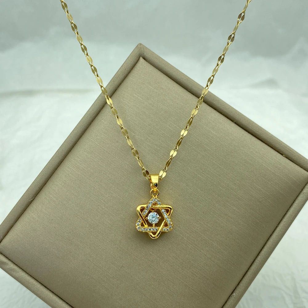 gold-tone broken heart pendant with pavé clear stones and a jagged center split on a chain