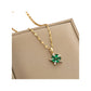 gold-tone pendant necklace with green floral cluster and baguette clear accents