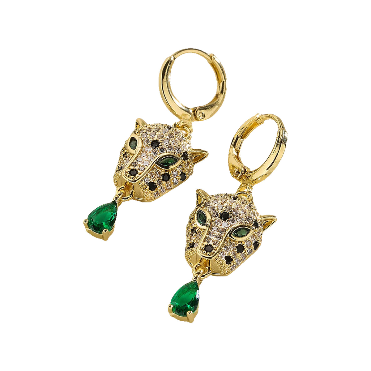 Leopard head huggie earrings with green teardrop drops laid on a glossy white surface