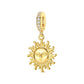 Gold-tone sun face dangle charm with textured rays and crystal-accented bail
