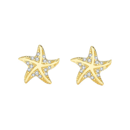 Pair of gold-tone starfish stud earrings with clear pavé stones on each arm, shown on a white background.