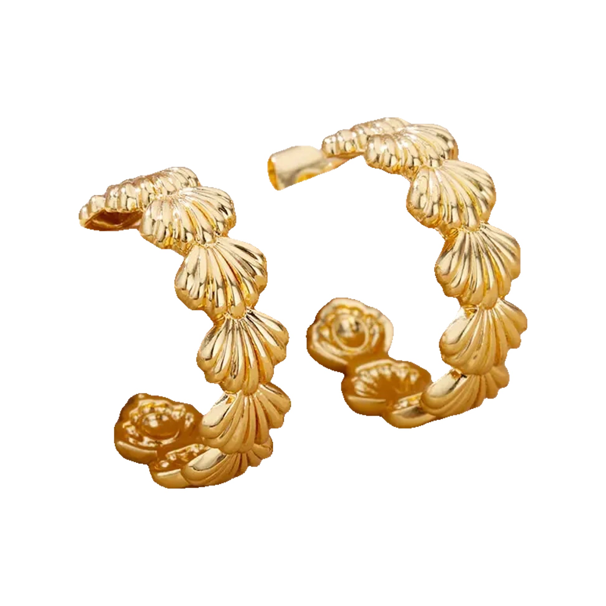 gold-tone scallop-pattern hoop earrings resting on fabric