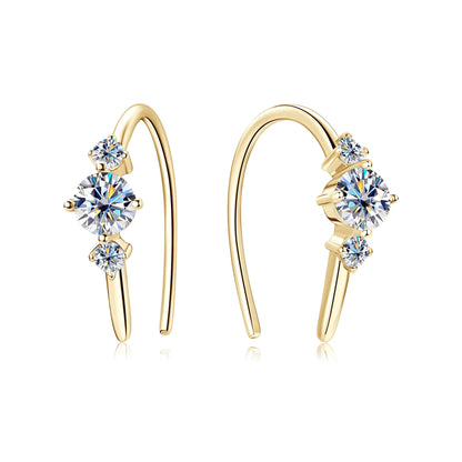 Gold-tone U-shaped hoop earrings with three round clear stones in graduated sizes, prong-set along the front.