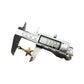 Gold-tone starfish charm shown with caliper measuring its size