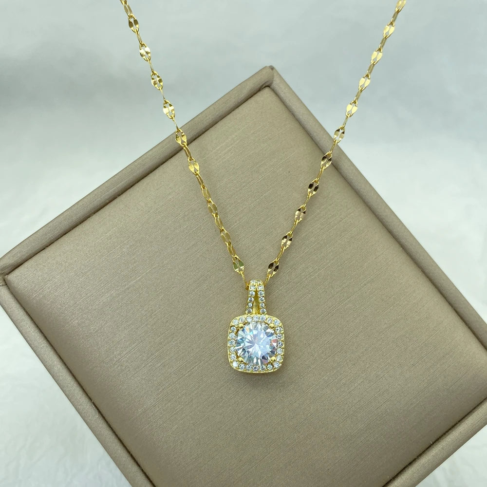 gold-tone pendant necklace with cushion halo and round center stone
