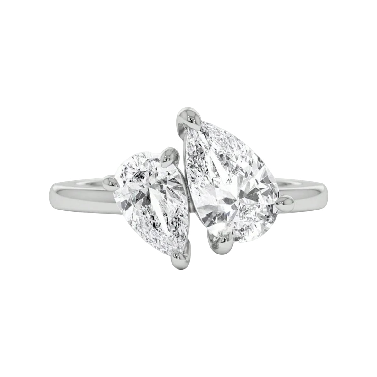 silver-tone bypass ring with two pear-cut stones on a white background