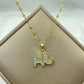 gold-tone elephant silhouette pendant outlined with clear pavé stones on a patterned chain