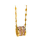 Gold-tone barrel pendant with pink baguette crystals hanging against a creamy fabric backdrop