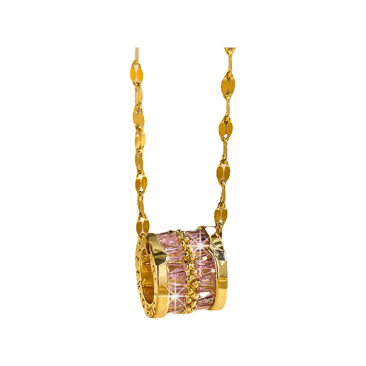 Gold-tone barrel pendant with pink baguette crystals hanging against a creamy fabric backdrop