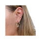 Gold-tone 25 mm hoop with marquise chain dangle worn at the earlobe among multiple piercings