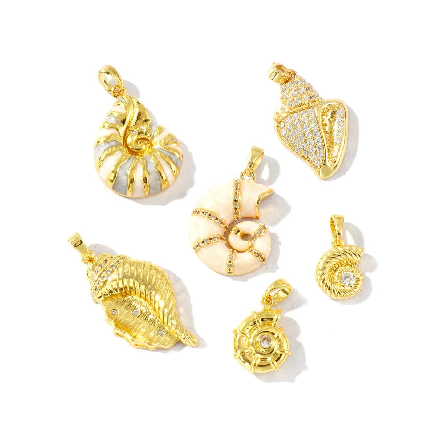 Set of six gold-tone shell charms photographed on a bright white studio surface
