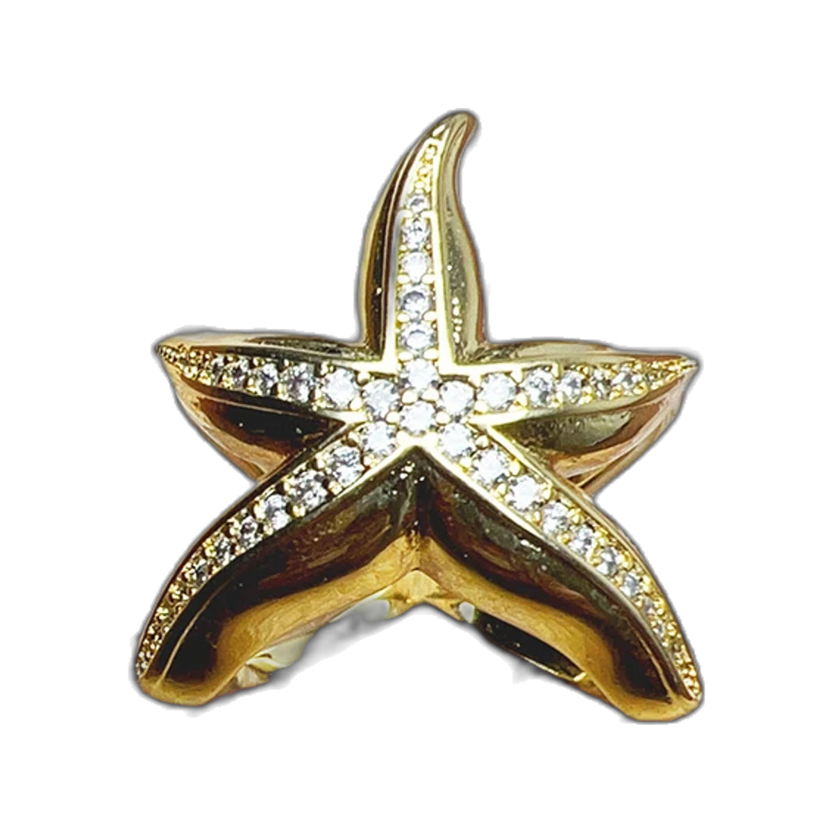 Gold-tone starfish pavé ring top view on pastel textured painted backdrop
