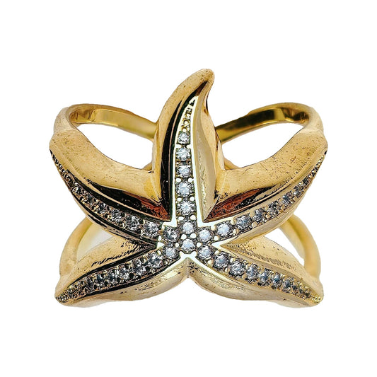 Close-up of gold-tone starfish ring showing clear pavé stones along each arm