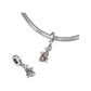silver-tone small fish dangle charm hanging from European bracelet with spare charm beside it