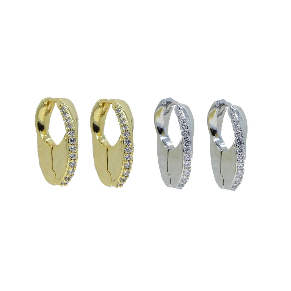 Two pairs of mini huggie hoops, gold-tone and silver-tone, shown side by side