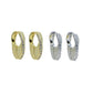 Set of gold-tone and silver-tone mini huggie hoops displayed in matching pairs