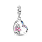 Heart dangle charm featuring mother and child motif with pink enamel dress and multicolor crystals