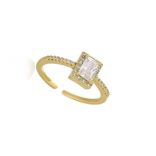 Gold-tone adjustable open ring with a square halo and clear center stone