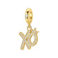 Gold-tone XO letter dangle charm encrusted with clear stones and crown accent