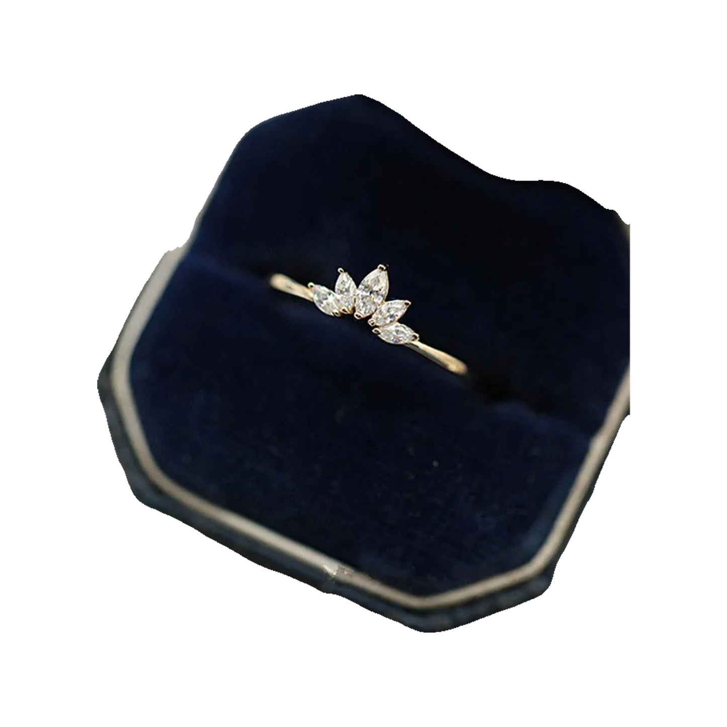 Ring nestled in a navy velvet jewelry box with cream-trimmed edges