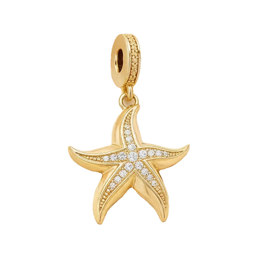 Gold-tone starfish charm with clear pave stones on a large-hole ring attachment