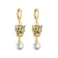 Gold-tone leopard head huggie earrings with single round faux pearl drops shown frontally