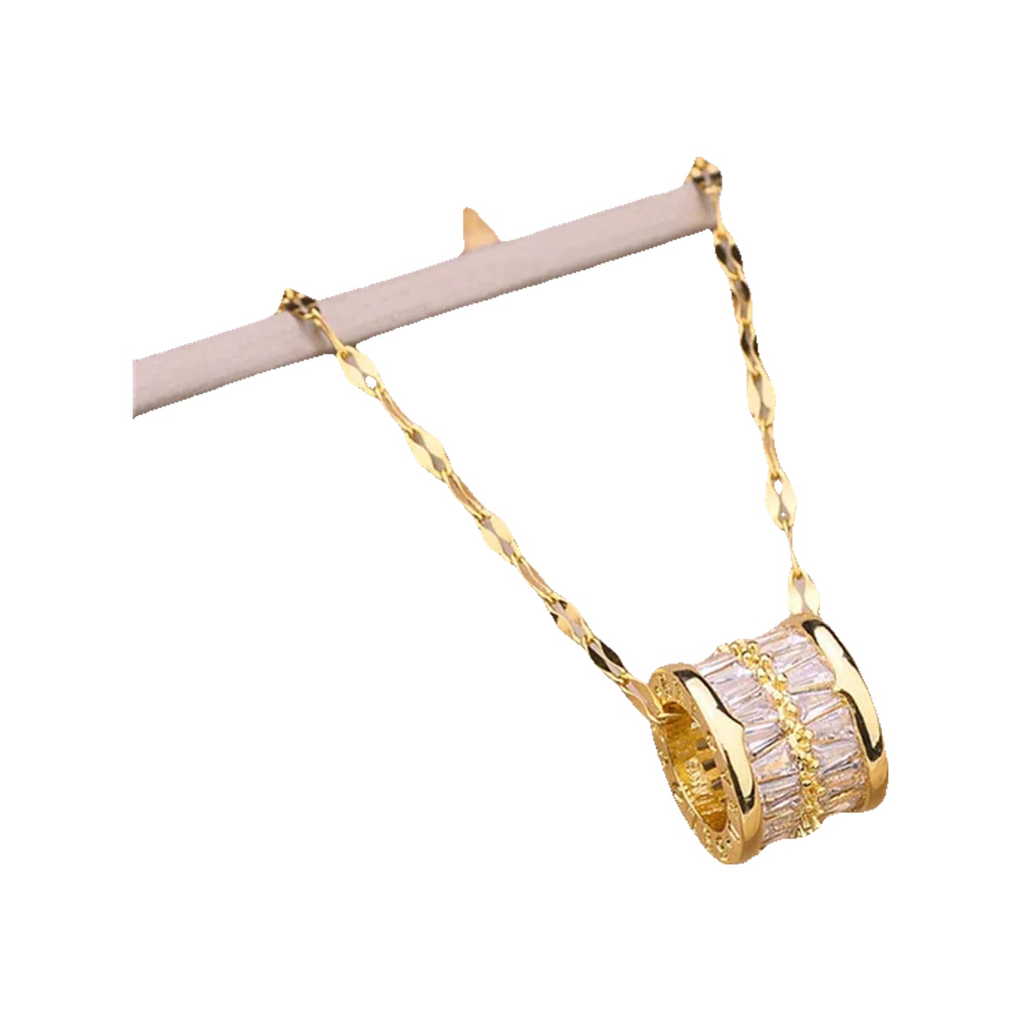 Barrel pendant with baguette crystal rows on a gold-tone textured chain, on beige cushion
