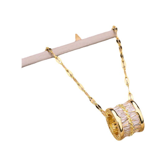 Barrel pendant with baguette crystal rows on a gold-tone textured chain, on beige cushion