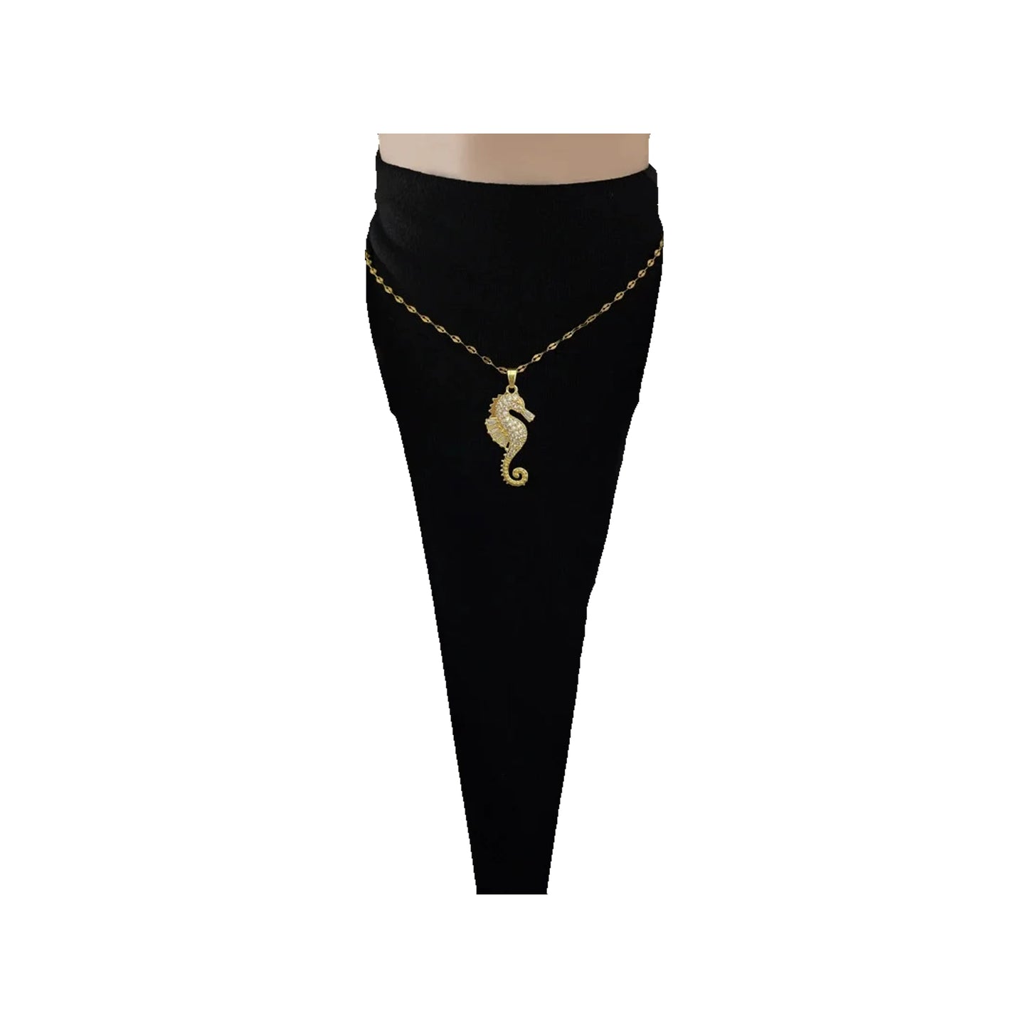 Gold-tone seahorse pendant necklace worn at the collarbone over a black top