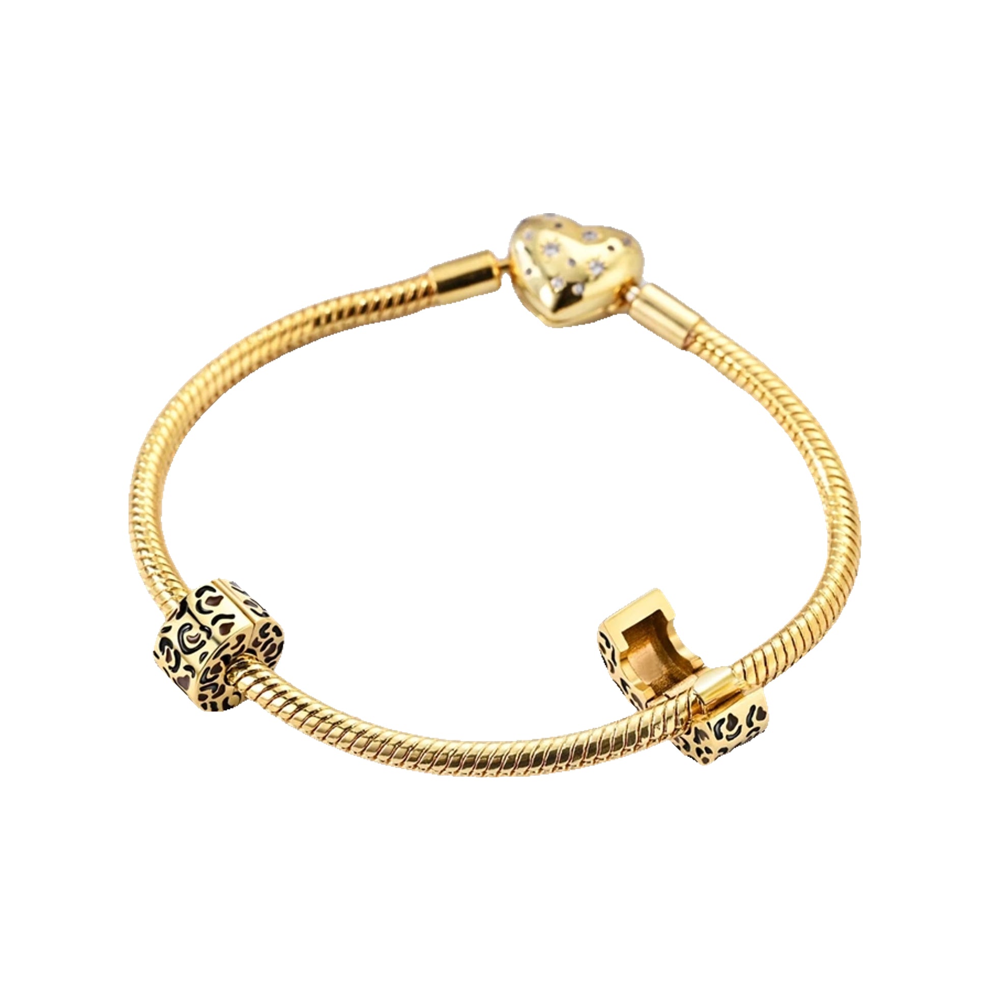 Gold-tone snake bracelet with heart clasp and patterned barrel beads, one bead shown open