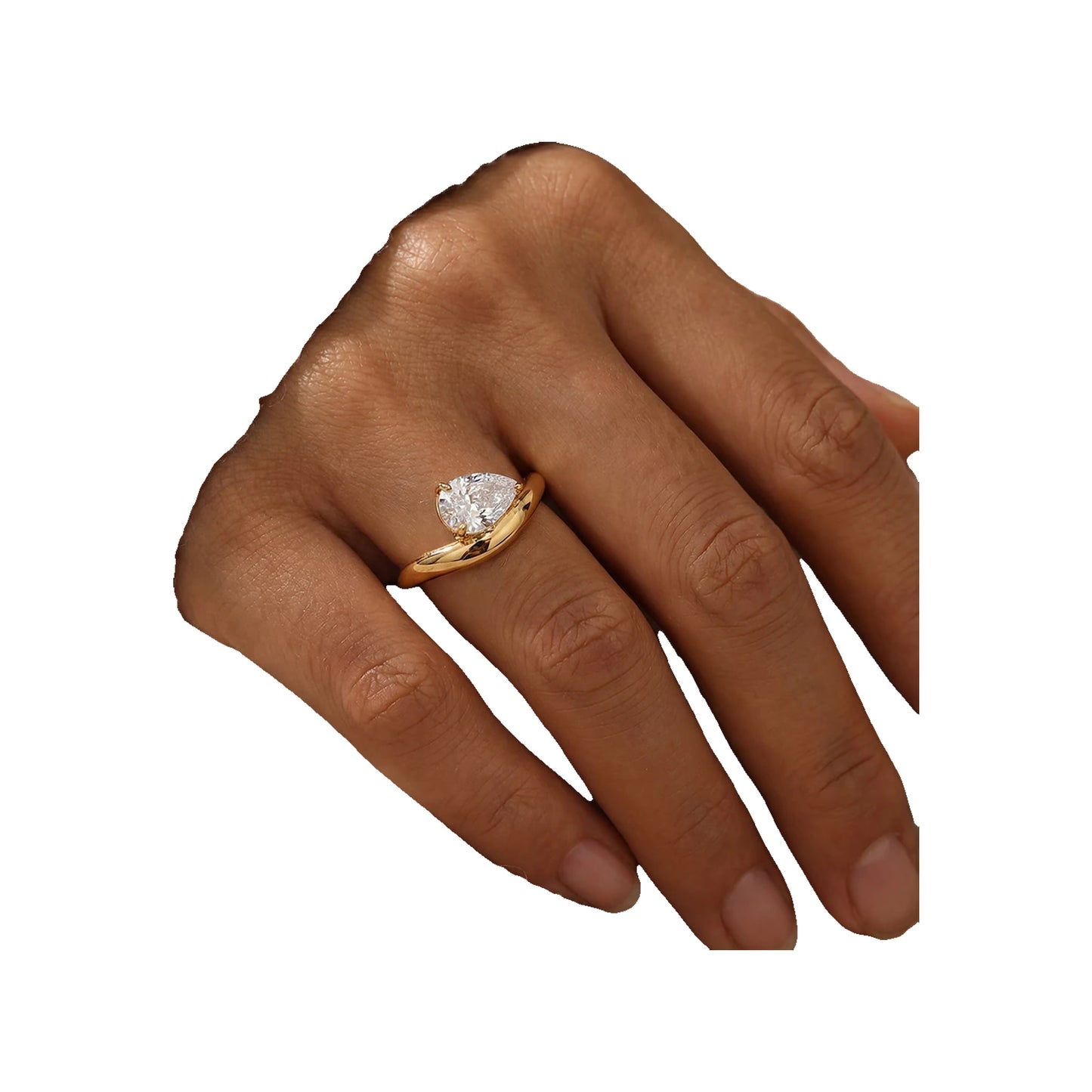 hand wearing a gold-tone pear-cut solitaire ring on the middle finger
