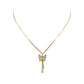 Gold-tone butterfly pendant with dangling accents worn at the collarbone
