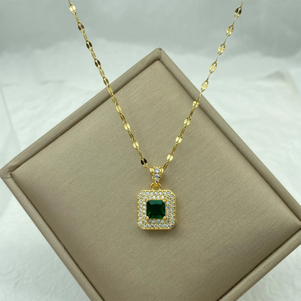 gold-tone pendant necklace with square green center stone and pavé halo