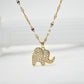 Gold-tone elephant pendant necklace with clear pavé stones on patterned chain