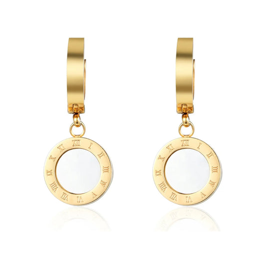 Gold-tone hoop drop earrings with circular Roman numeral ring and white inlay center, front view