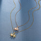 Two delicate chains, one gold-tone and one rose gold-tone, each with a starfish pendant; extenders are visible at the ends.