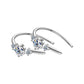 Silver-tone three-stone U-hoop earrings angled flat lay