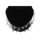 gold-tone and silver-tone Starburst dangle chokers layered on a black display