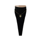 Gold-tone heart pendant necklace worn at the collarbone
