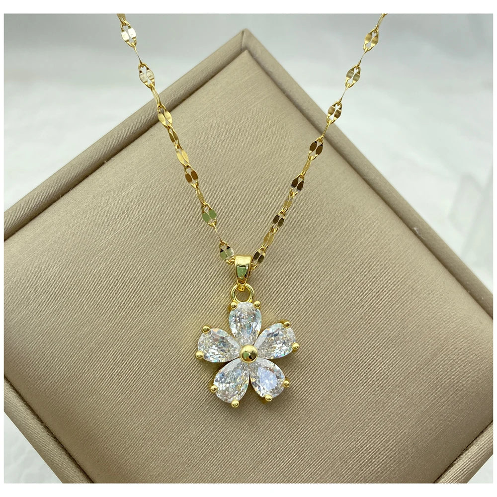 gold-tone flower pendant necklace with teardrop clear stone petals