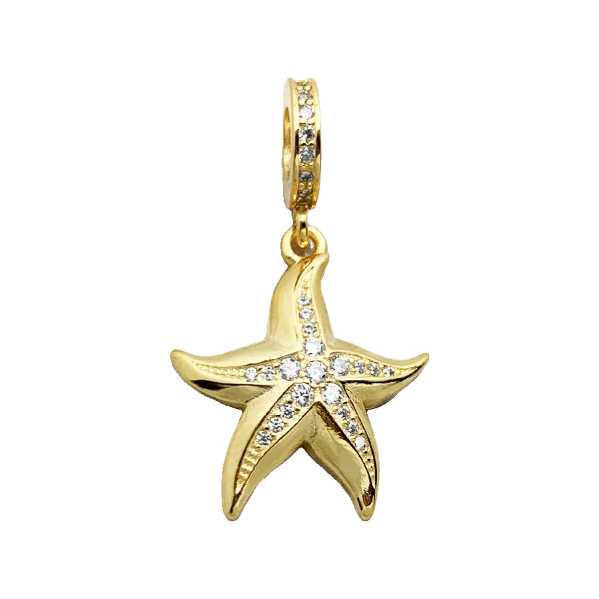 Gold-tone starfish pendant charm with crystal-accented bail on a light marbled background